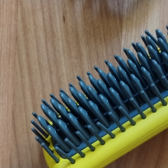 The Drybar Baby Brush Crush Mini Heated Straightening Brush is compact and has a - Picture 5 of 5